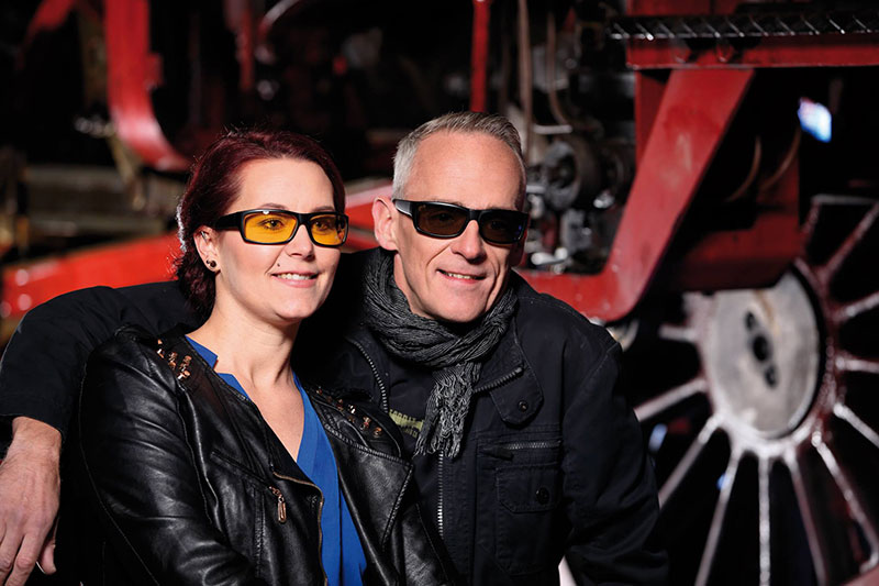 Man and woman wearing improvision wraparound glasses