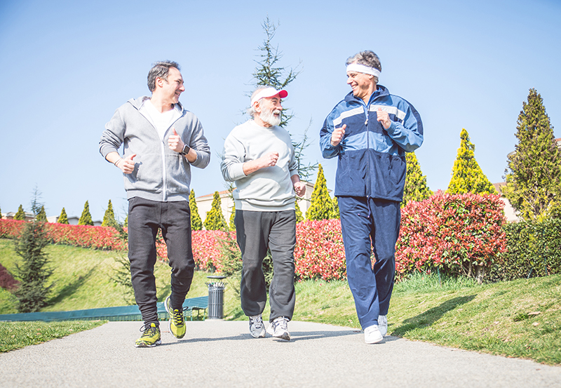 Three senior men are jogging