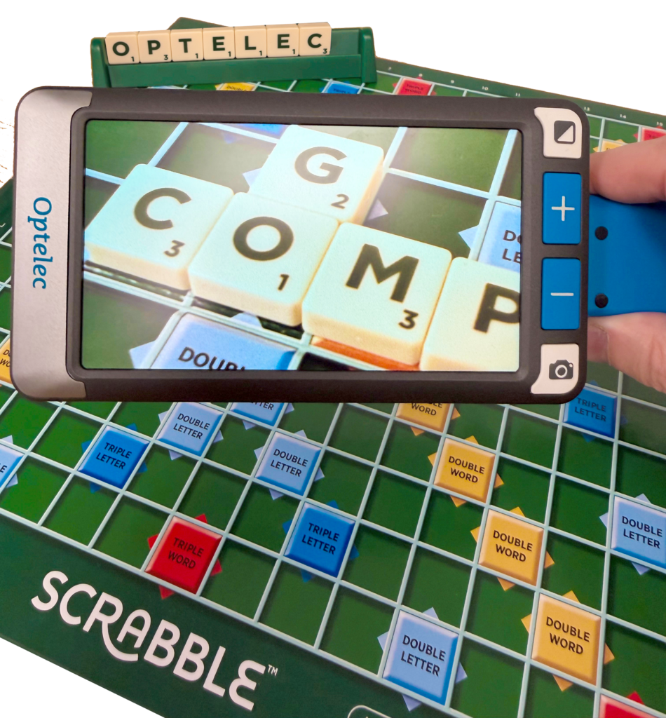 The Compact GO looking down on a Scrabble board